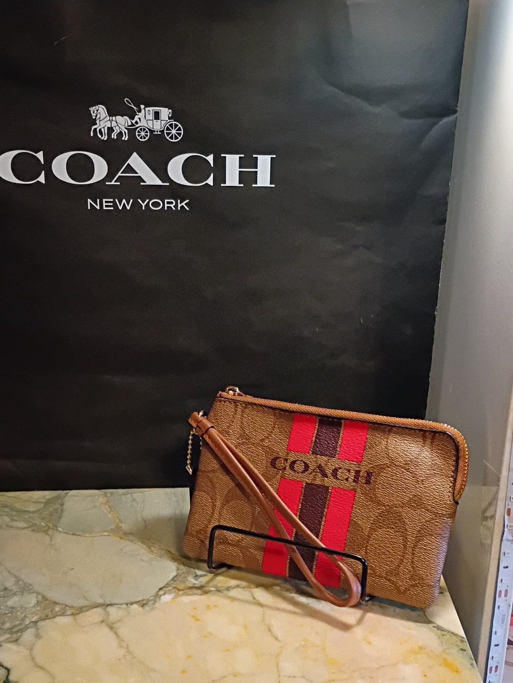 COACH Brown Signature Wristlet with Pink And Dark Brown Striped Accent